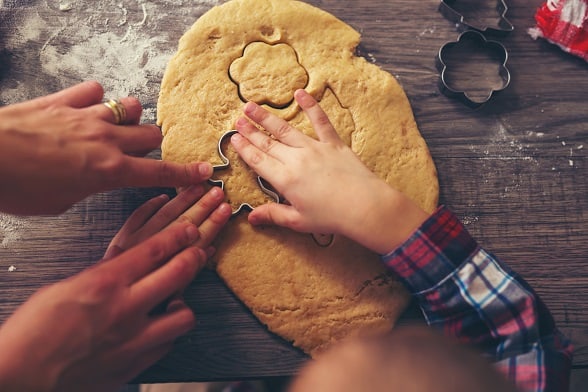 Top view of cutting gingerbread of metal molds